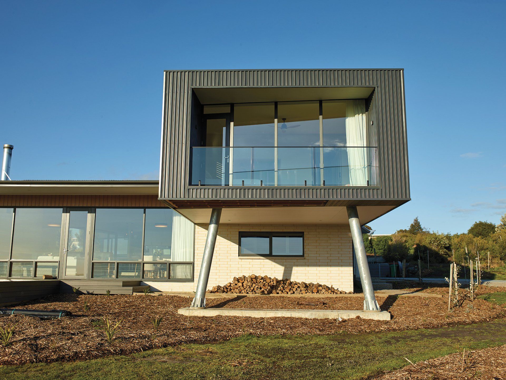 A house with a balcony and a lot of windows