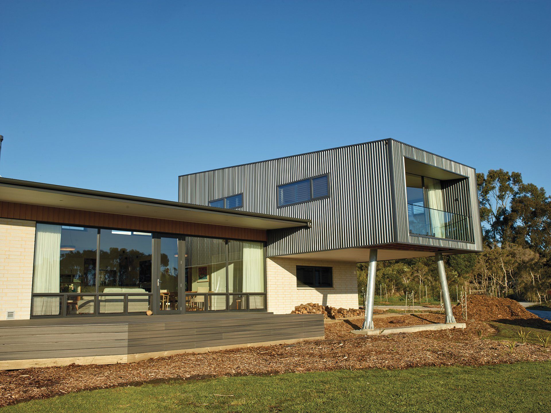 A modern house with a zebra print on the side of it