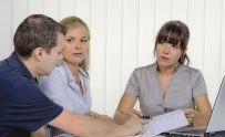An accountant consults with clients