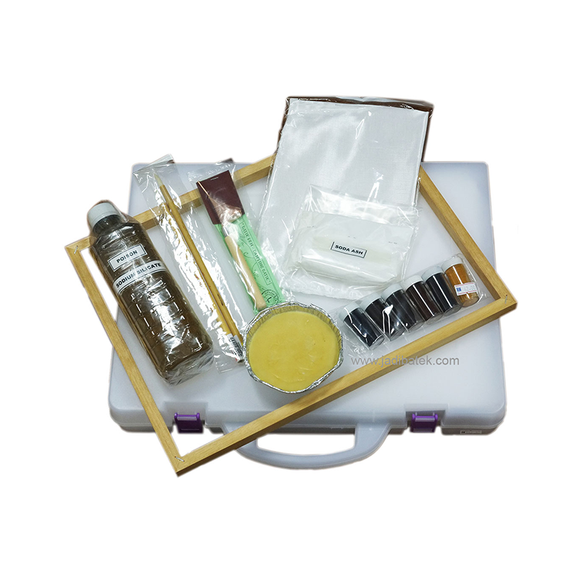 Open craft kit with supplies for art projects, including paint, brushes, and various tools.