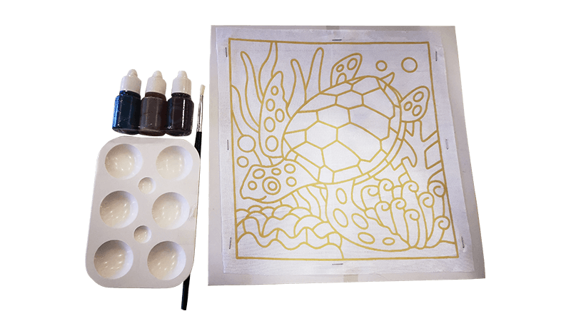 Painting kit: sea turtle outline with paint bottles, palette, and brush.