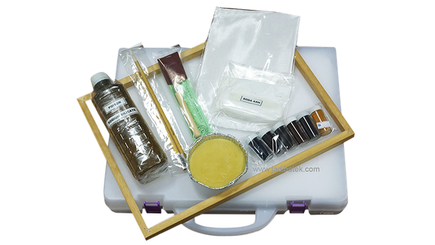 Art supply kit in a white case, including paints, brushes, and a canvas frame.