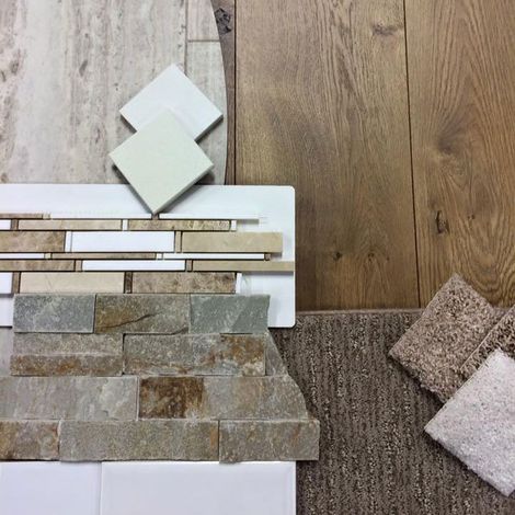 multiple flooring samples of carpet, tile, and wood