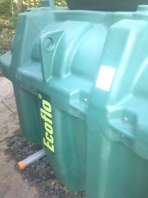 A green container with the word ecoflo on it