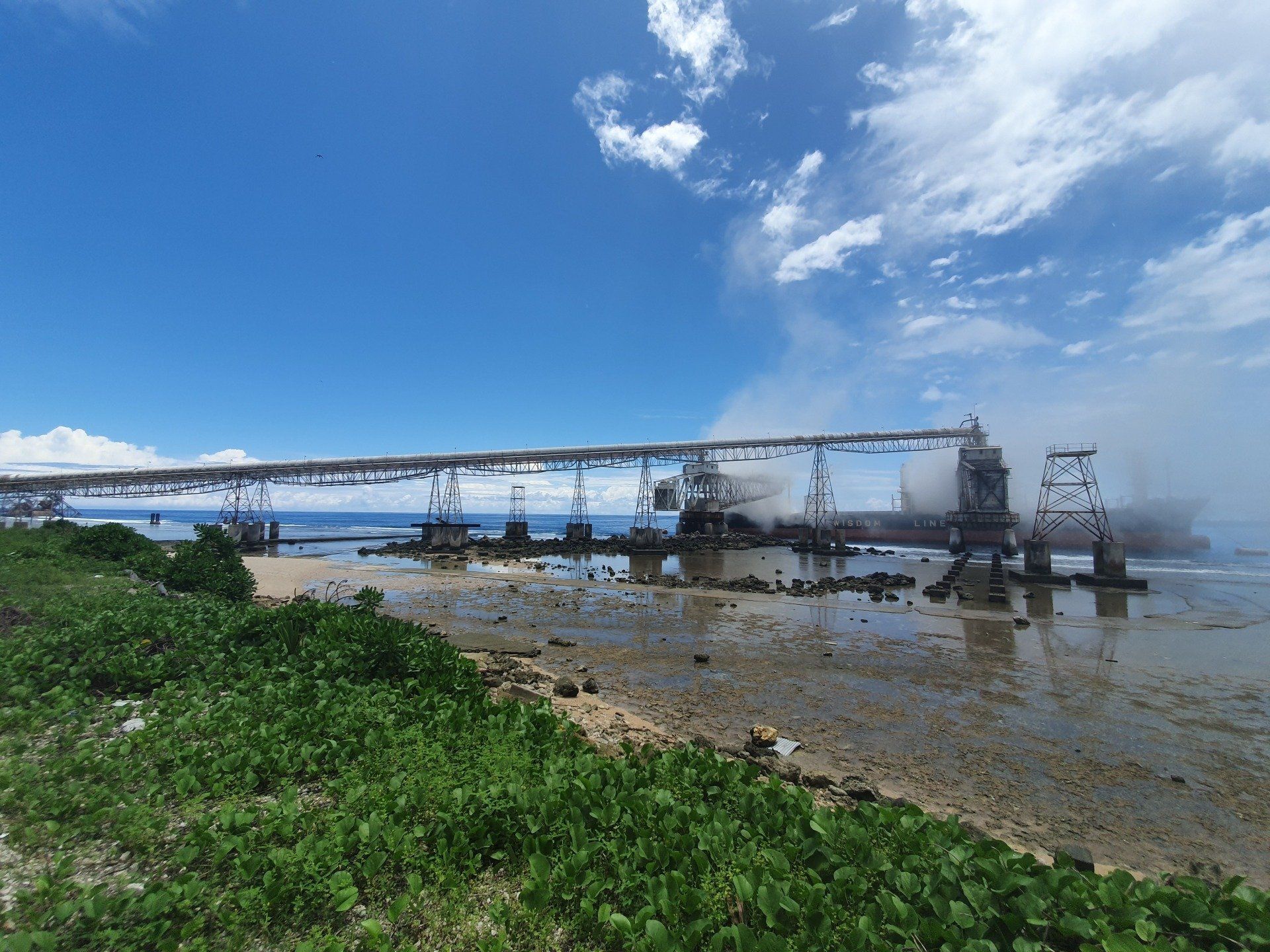 a bridge over a body of water on a sunny day