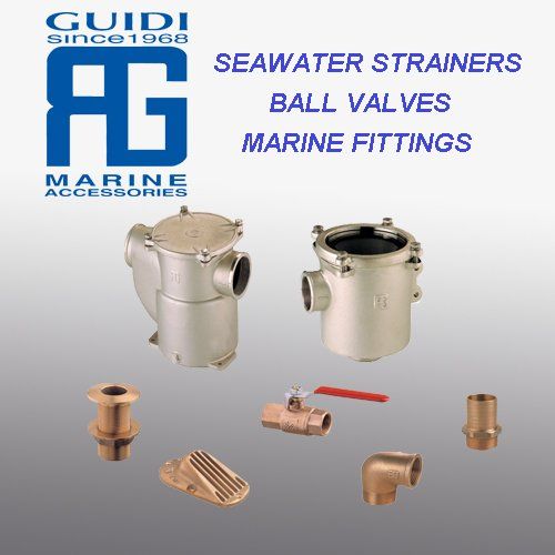 Guidi marine accessories display: two seawater strainers, a ball valve, and various brass marine fittings on a gray background.