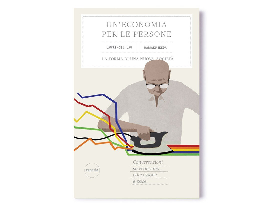 Un uomo sta stirando un pezzo di stoffa sulla copertina di un libro.