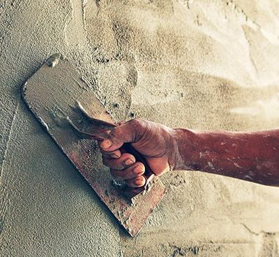 Concrete Contractors — Construction Worker Plastering Cement on Wall in Cinnaminson, NJ Concrete Contractors — Construction Worker Plastering Cement on Wall in Cinnaminson, NJ