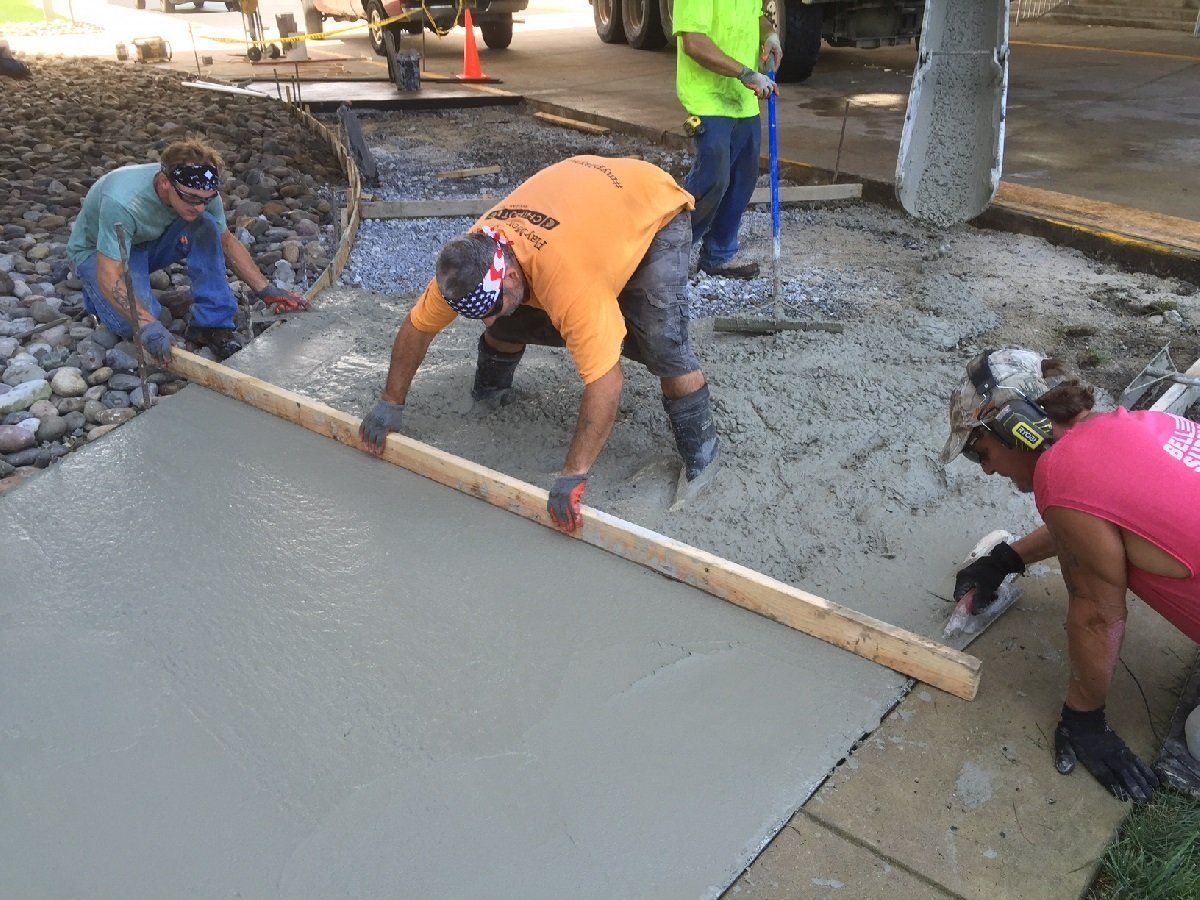 Man with Wooden Spatula for Cement — Cinnaminson, NJ — A & M Masonry and Concrete