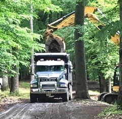 Placing septic system in ground — Septic Contractors in Hampton, NJ Placing septic system in ground — Septic Contractors in Hampton, NJ