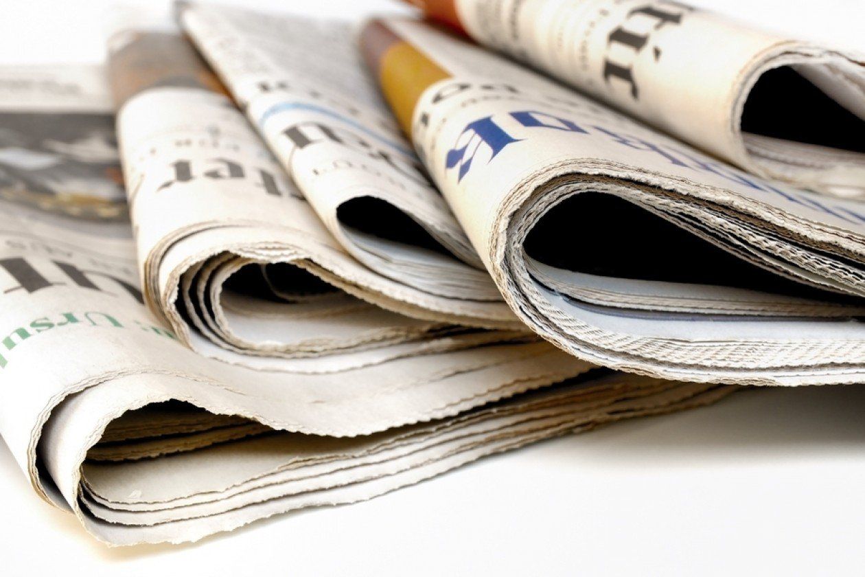 foldede newpapers laying on top of each other