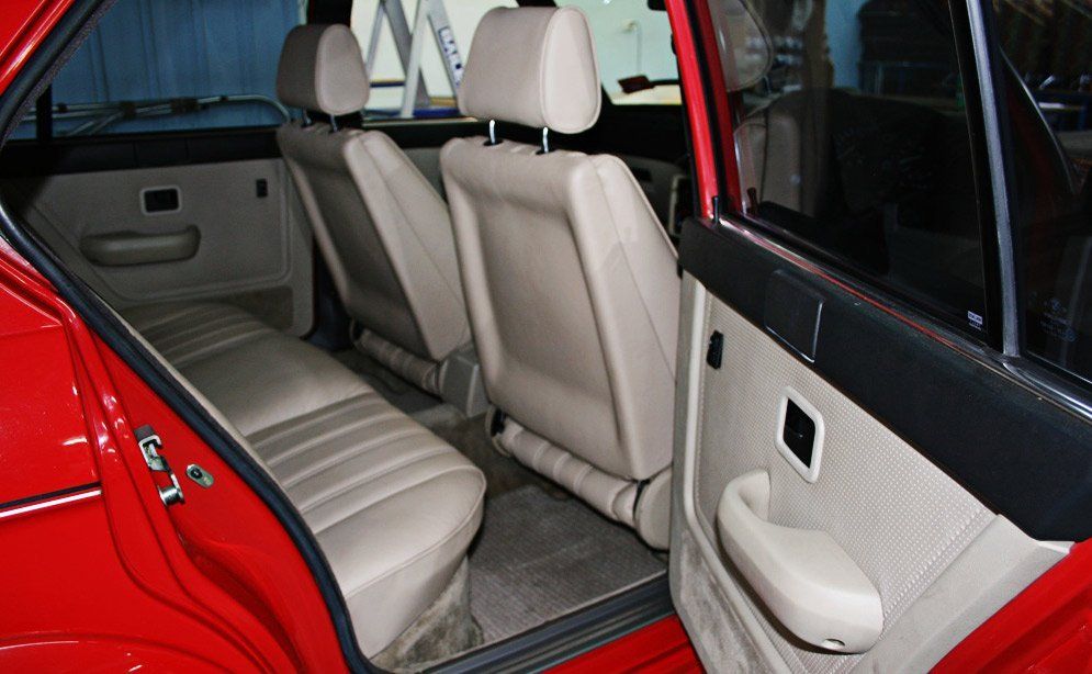 red car with white seats