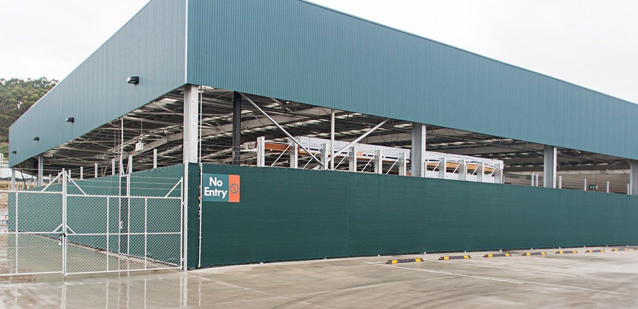 green building with protective screening