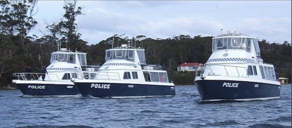 three white and blue ship class boat