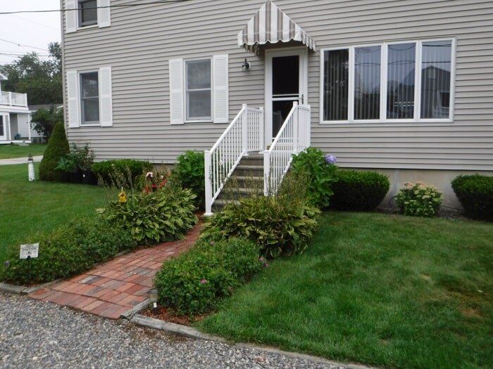 Stairs with White Handrails — Barrington, NH — 125 Maintenance & Fence Inc