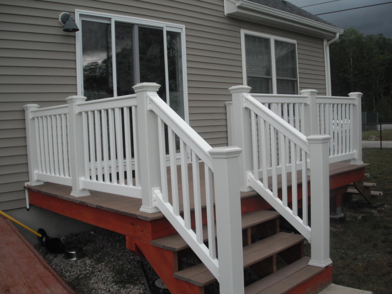 New House with White Handrail — Barrington, NH — 125 Maintenance & Fence Inc