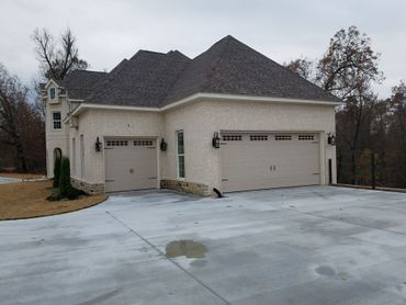Wooden double garage doors at a residential property