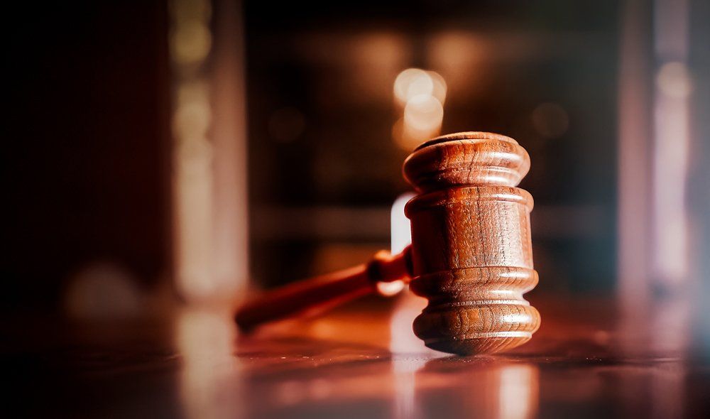 Gavel Under the Wooden Table — Hanford, CA — Lucky Bail Bonds-Kings County