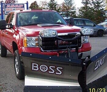 Orange vehicle — Towing Services in Alma, MI Orange vehicle — Towing Services in Alma, MI