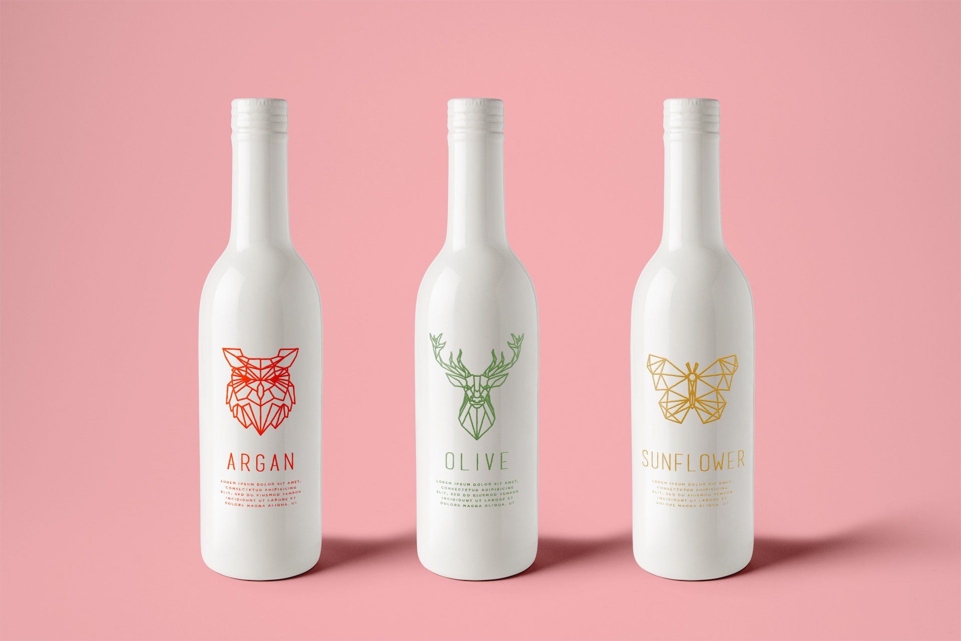 three bottles of argan olive and sunflower on a pink background