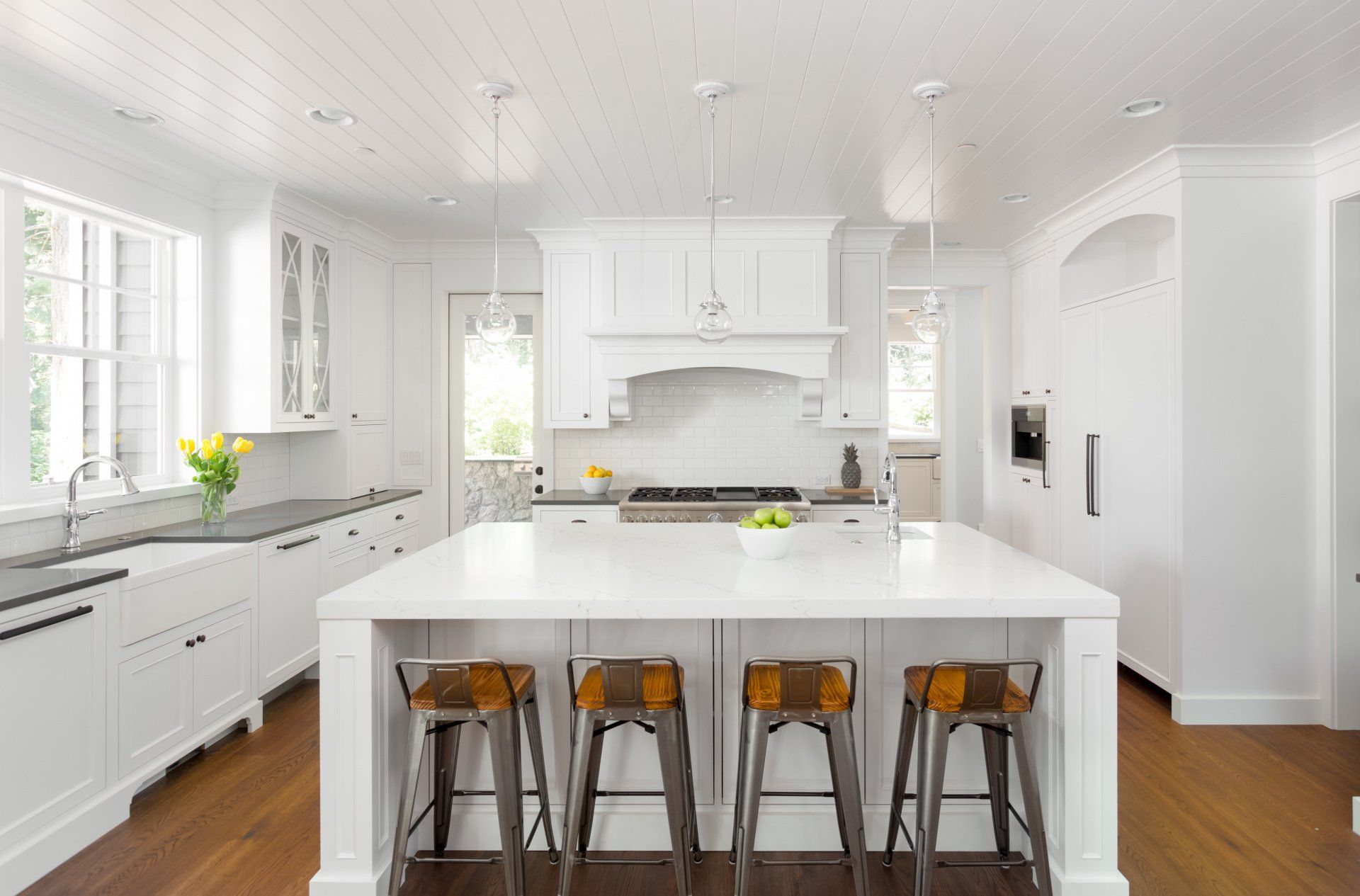 There is a large island in the middle of the kitchen.