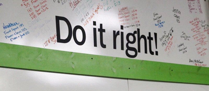 A white board with the words do it right written on it
