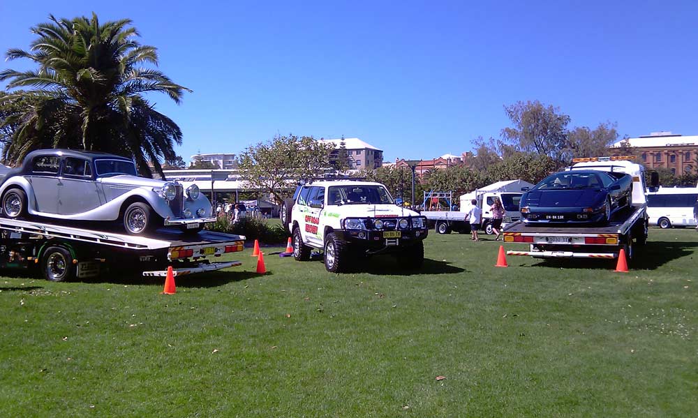 car show cars on tow trucks