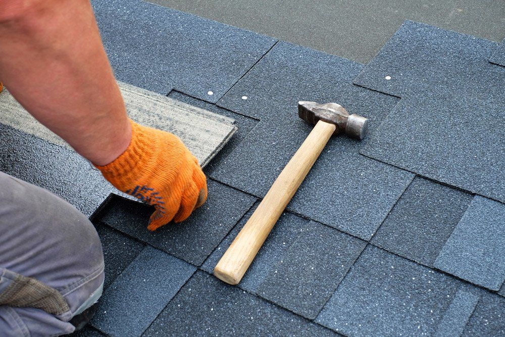 Roofing West Boro — Contractor Installing Roof Shingles in West Boylston, MA