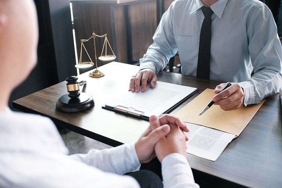 an attorney providing legal advice to a client across a desk