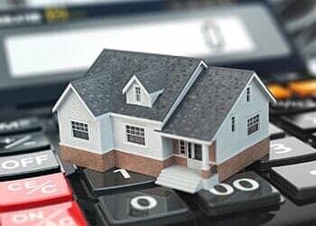 Miniature House Over a Calculator — Santa Cruz, CA — Dan Casagrande - Reverse Mortgages Miniature House Over a Calculator — Santa Cruz, CA — Dan Casagrande - Reverse Mortgages