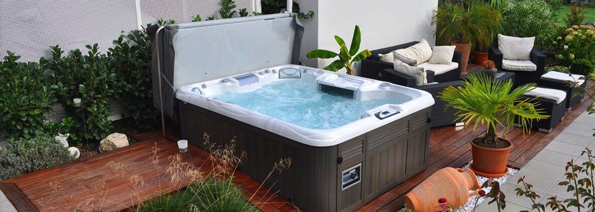 Hot Tub With Chairs On The Side — Staunton, VA — Valley Pool & Spa Hot Tub With Chairs On The Side — Staunton, VA — Valley Pool & Spa