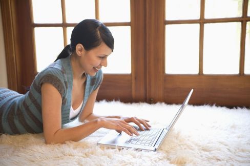 woman searching online for carpet care cleaning in Toowoomba
