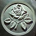 rose engraved on stone of memorial