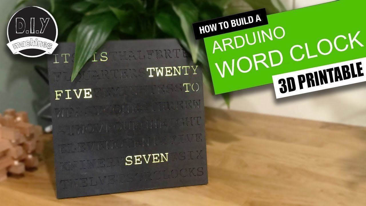 A black 3D-printed word clock displaying 