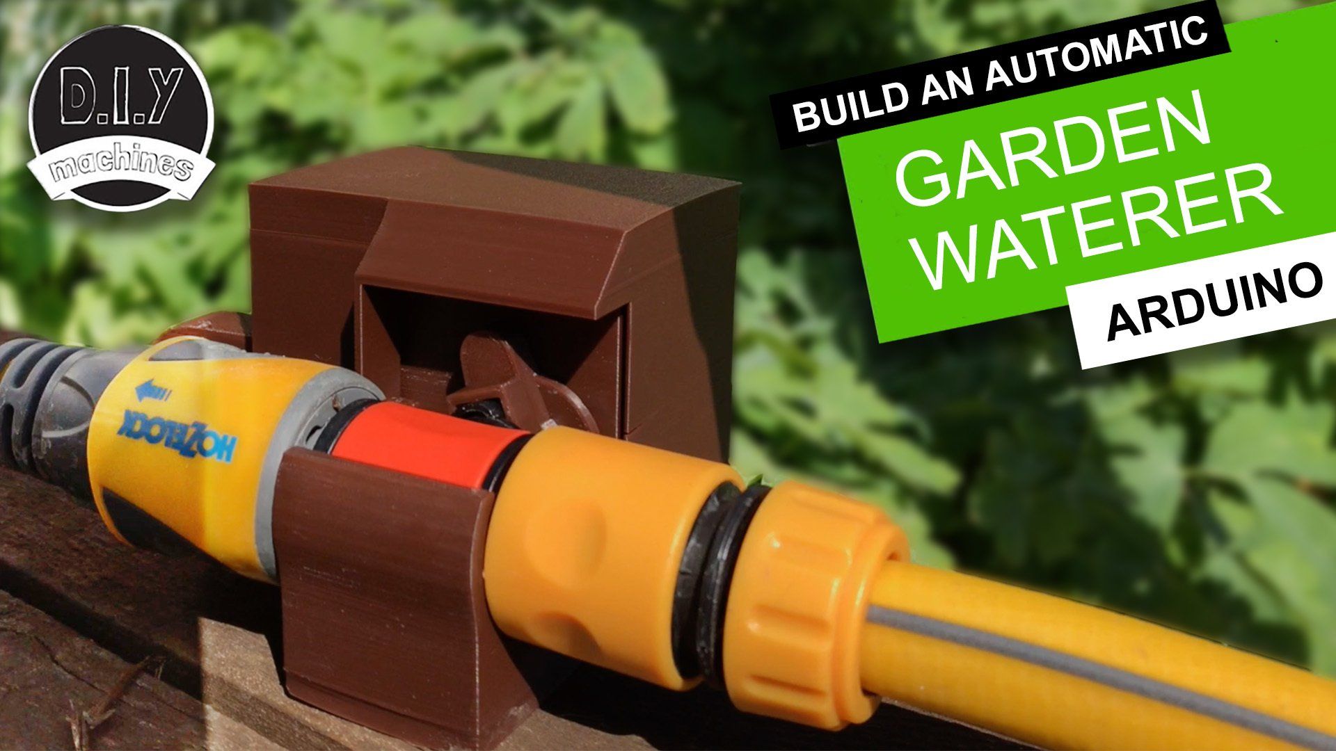 A 3D-printed brown housing clamps onto a yellow garden hose connector to automate an Arduino-based garden watering system.