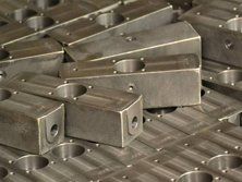 Shot blasting mechanical metal parts