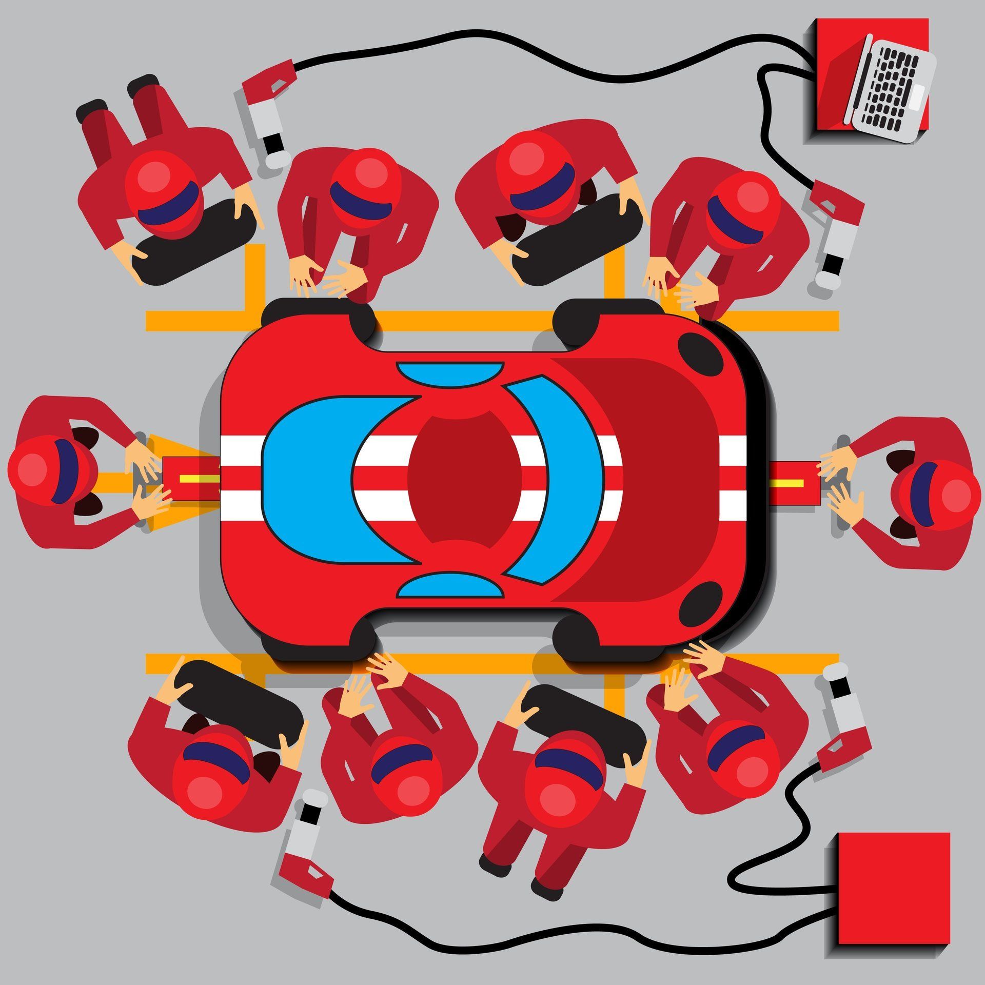 Boxencrew umringt ein rotes Rennauto und führt einen Reifenwechsel durch.