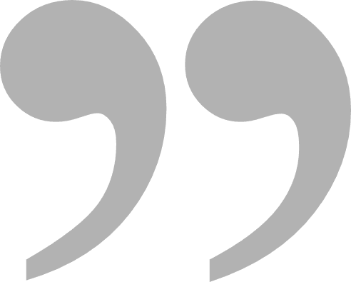 A pair of gray commas on a white background.
