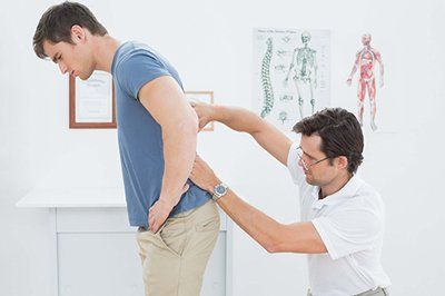 Chiropractor and Patient — Chiropractic Care, Chiropractic Adjustment in Danville, VA Chiropractor and Patient — Chiropractic Care, Chiropractic Adjustment in Danville, VA