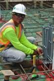 Isaiah Jiminez of Mr. T's Pest Control installs Termimesh to cluster of pens at this Wailupe Circle future residential home being built by Armstrong Builders.
