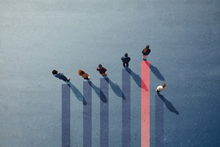 A group of people standing on top of a graph.