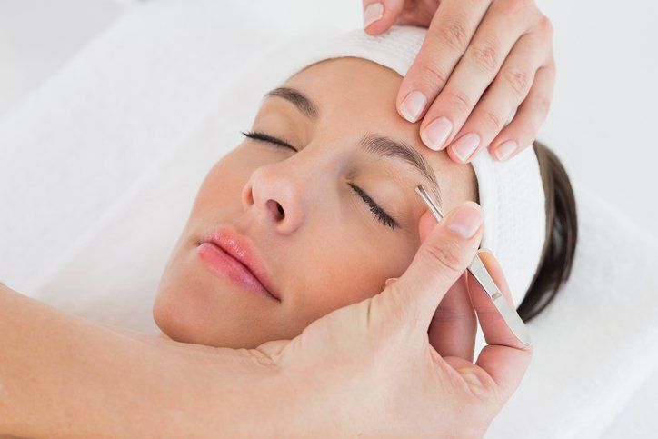Eyebrow Waxing — Woman Having Eyebrow Removal in West Springfield, MA Eyebrow Waxing — Woman Having Eyebrow Removal in West Springfield, MA