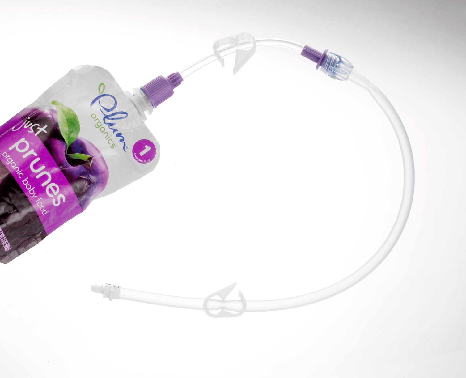 Bolink Small Cap attached to a puree food pouch and bolus extension set