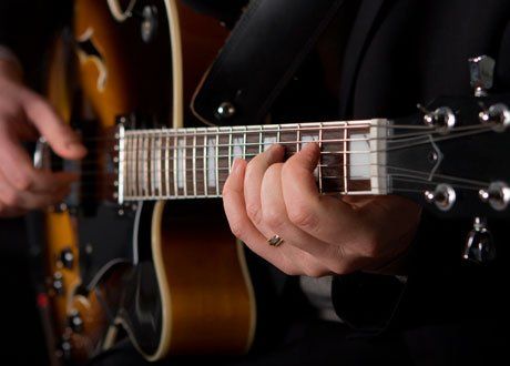 Person playing guitar