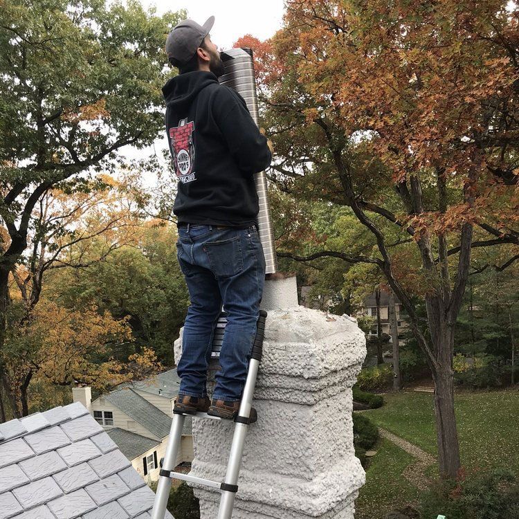 Man Holding Chimney Liner — Wayne, NJ — Chimney Pros Our chimney repair services in West Milford, NJ