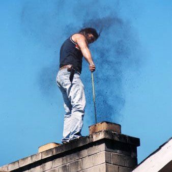 Man Cleaning on Chimney — Wayne, NJ — Chimney Pros