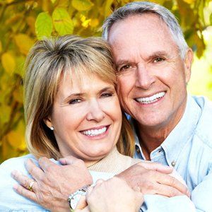 elderly couple smiling