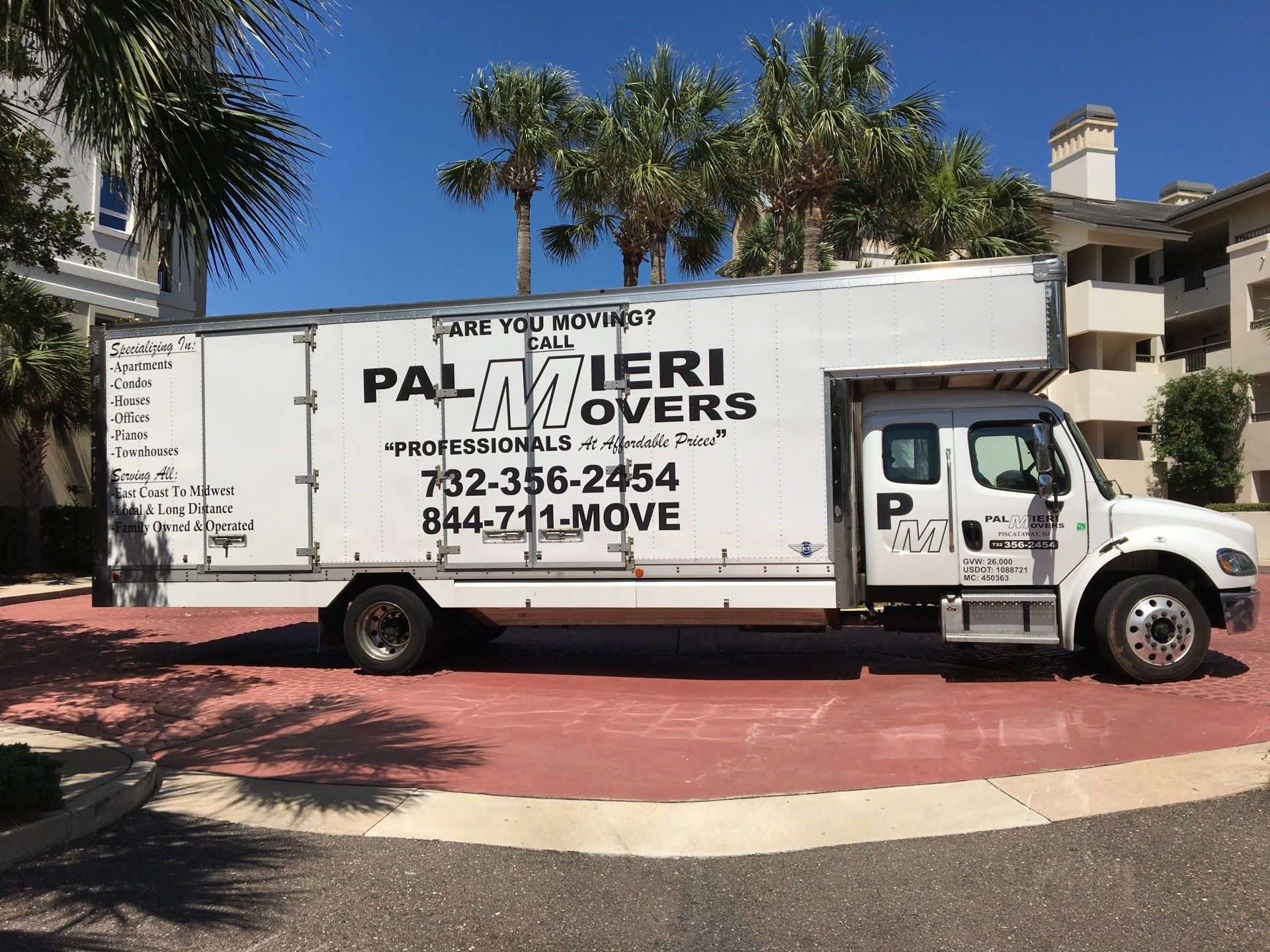 Two Movers Loading Boxes In Truck - Movers in Piscataway, NJ