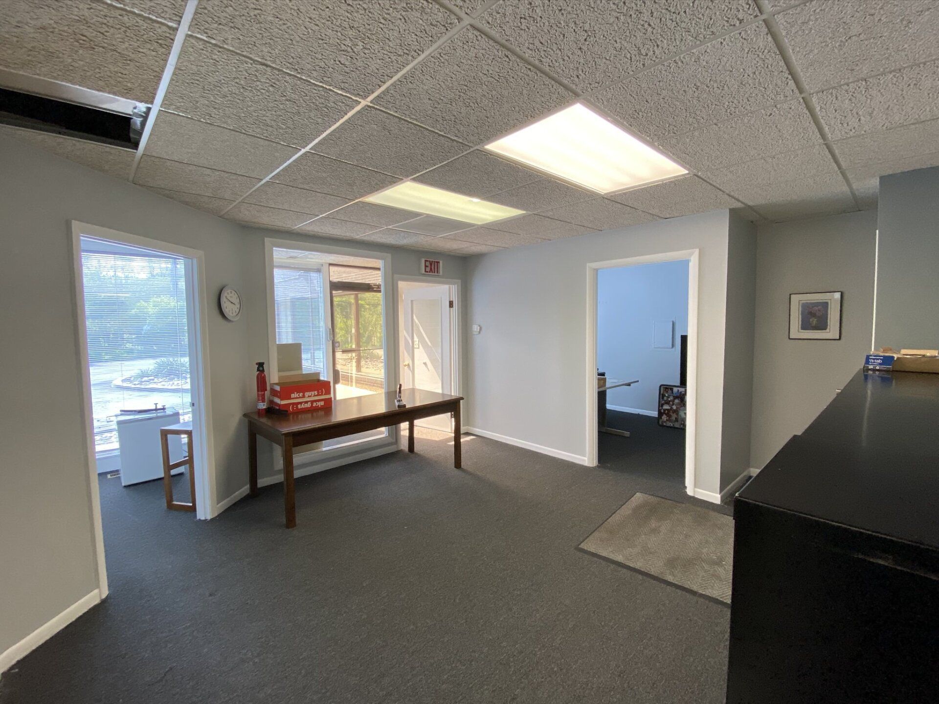 There is a table in the middle of the room.