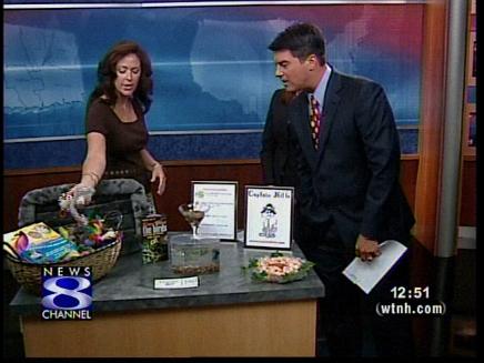 photo of val / owner on channel 8 news interview featuring Captain Kitt's Cat Boarding 